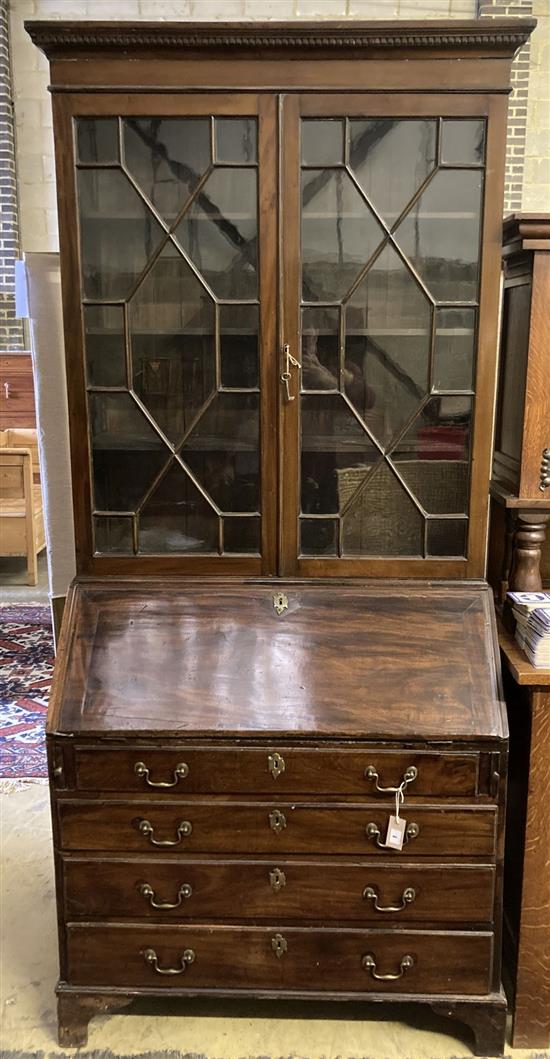 A George III mahogany bureau bookcase, width 100cm, depth 52cm and 26cm top, height 221cm